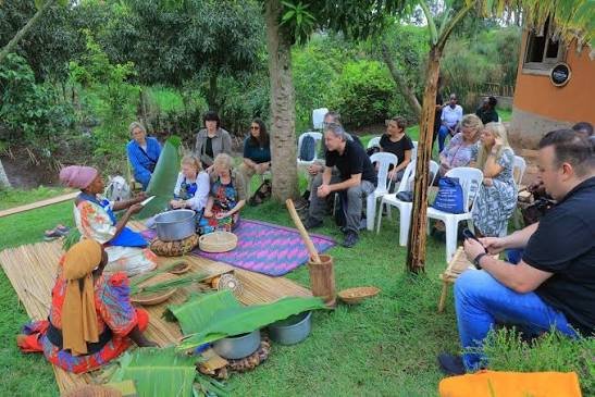 Tourists enjoying a cultural experience in Uganda