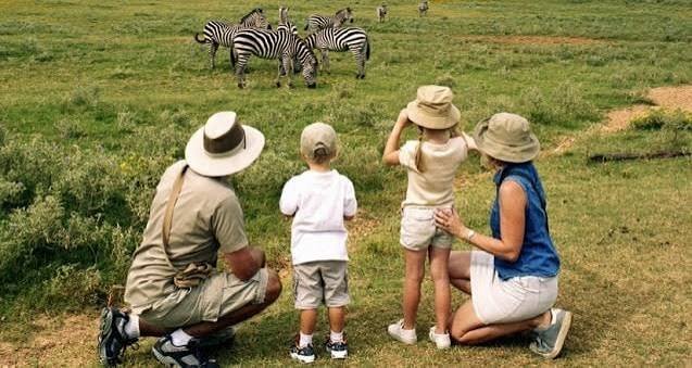 Family enjoying wildlife viewing .